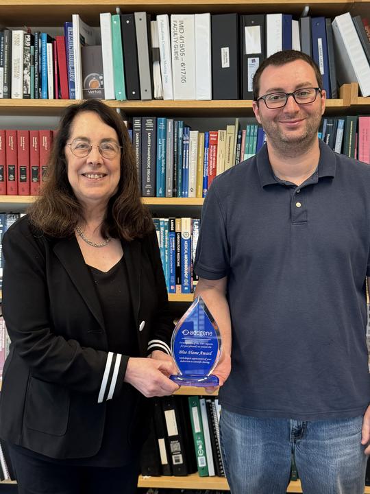 Arlene and Marty LaFleur pose with their Addgene Blue Flame trophy